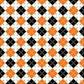 Seamless argyle pattern with dashed lines in orange, black and white. eps10 Royalty Free Stock Photo