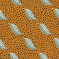 Seamless autumn pattern with pale grey leaves silhouettes. Orange dotted background. Nature stylized backdrop