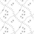 Seamless background with bird`s tracks. Monochrome hand drawn texture.