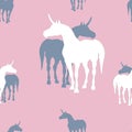 Seamless background of silhouettes of unicorns on pinc background