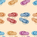 Seamless background of colorful striped beach slippers