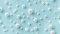 The seamless background is made of white pearls on a light blue background