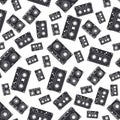 Seamless background pattern hipster style with audiocassette. Music. Sound. Retro. Magnetic tape. Analogue multimedia