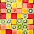 Seamless background pattern and texture of colourful fresh diced tropical fruit cubes arranged in a geometric pattern with melon Royalty Free Stock Photo