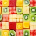 Seamless background pattern and texture of colourful fresh diced tropical fruit cubes arranged in a geometric pattern with melon Royalty Free Stock Photo