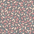 Seamless background patterns of leaves in pastel colours on a background of graphite .