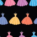 Seamless background of silhouettes colorful female gowns