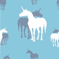 Seamless background of silhouettes of unicorns on colored background