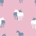 Seamless background of silhouettes of unicorns