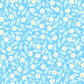 Seamless background of small daisies leaves on a blue background. Pattern for fabric, wrapping paper and scrapbooking