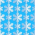 Seamless background with snowflakes. White paper snowflakes with shadow on blue background. Winter pattern. Royalty Free Stock Photo