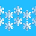 Seamless background with snowflakes. White paper snowflakes with shadow on blue background. Winter pattern. Royalty Free Stock Photo