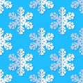 Seamless background with snowflakes. White paper snowflakes with shadow on blue background. Winter pattern. Royalty Free Stock Photo