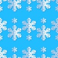 Seamless background with snowflakes. White paper snowflakes with shadow on blue background. Winter pattern. Royalty Free Stock Photo