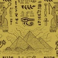 Seamless background with Sphinx, pyramids and traditional Egyptian symbols