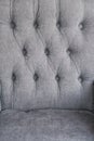 Seamless background texture close up of a grey sofa back with button detail on a thick cloth. Royalty Free Stock Photo