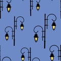 Seamless background of vintage street lights silhouettes Royalty Free Stock Photo