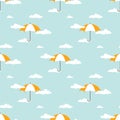 Seamless background with white clouds and orange umbrellas on powder blue sky Royalty Free Stock Photo