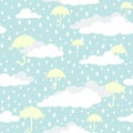 Seamless background with white clouds, umbrellas and raindrops on blue sky Royalty Free Stock Photo