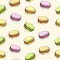 Seamless beige background with colored macaroons. Cartoon style.