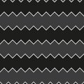 Seamless black and white sawtooth zig-zag pattern background.