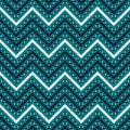 Seamless blue and white pattern of solid and dashed zigzag lines