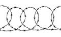 Seamless border of detailed black ravel barbed wire on white Royalty Free Stock Photo