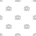 Seamless camera icon pattern on white background