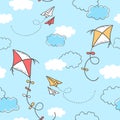 Seamless cartoon pattern with kites, paper planes and clouds on blue sky background Royalty Free Stock Photo