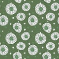 Seamless chamomile pattern on green background