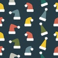 Seamless Christmas and New Year pattern of droll Santa hats