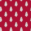 Seamless Christmas pattern of ginger cookies in the form of spruce on a burgundy background