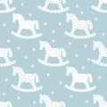 Seamless christmas pattern with rocking horses. Royalty Free Stock Photo