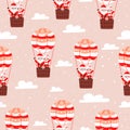 Seamless christmas pattern with santa claus and his wife flying on air ballon on pink background Royalty Free Stock Photo