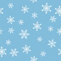 Seamless Christmas pattern with snowflakes on blue background