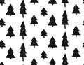 Seamless Christmas pattern with snowflakes and Christmas trees in gold and black on white background. Royalty Free Stock Photo