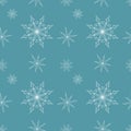 Seamless Christmas pattern with white snowflakes on blue background. Winter decoration.