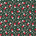 Seamless Christmas pattern with xmas stocking, stars and candy canes. Royalty Free Stock Photo