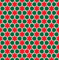 Seamless Christmas red and green star wrapping paper pattern. Royalty Free Stock Photo