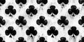 Seamless clubs or clover playing card suit pattern painted with black and white paint