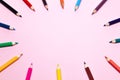 Seamless colored rainbow pencils lined around the contour, on pink background isolated. Concept of free space, copyspace, cover of Royalty Free Stock Photo