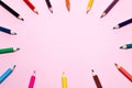 Seamless colored rainbow pencils lined around the contour, on pink background . Concept of free space, copyspace, cover of Royalty Free Stock Photo