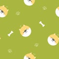 Seamless cute animal pet shiba inu dog repeat pattern with bone, foot print in green background Royalty Free Stock Photo