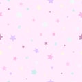 Seamless cute pattern with pink, yellow and green stars on pastel pink background Royalty Free Stock Photo