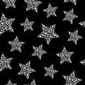 Seamless cute pattern with white stars made of dots and circles on black background. Vector illustration Royalty Free Stock Photo