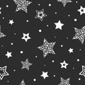 Seamless cute pattern with white stars made of dots and circles on black background Royalty Free Stock Photo