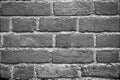 Seamless dark grey brick wall texture background. Pattern of weathered old cracked brickwall Royalty Free Stock Photo