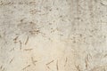 A seamless detailed background made of a gray concrete wall with cuts and a rust bloom.