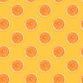 Seamless diagonal pattern of handmade dried orange slices on trendy yellow background