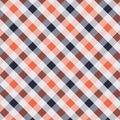 Seamless diagonal pixel plaid and checkered patterns in dark blue orange and white for textile design. Royalty Free Stock Photo
